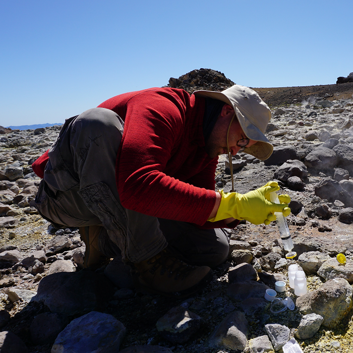 Water sampling on the Tolhuaca volcano in Chile during a research trip of Valentin Goldberg